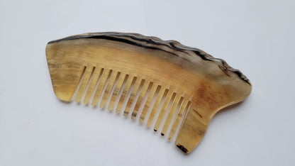 Rustic sheep horn wide-tooth comb — flat lay, front-facing view showing full profile