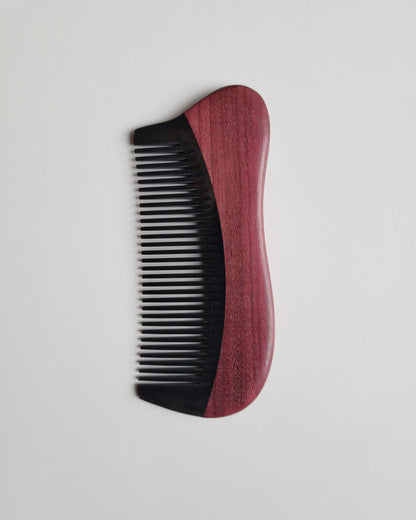 Hand inlaid wood and horn pocket comb, flat lay side angle highlighting curved handle and slim profile — Arakicrafts