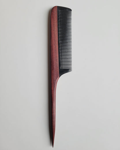 Hand-inlaid rat tail comb in purple heart wood and buffalo horn, reddish-brown jewel-toned handle with jet-black fine teeth