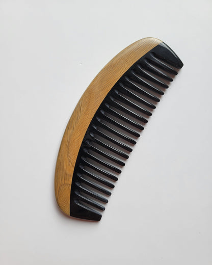 Classic Sandalwood Wide Teeth Horn Comb flat lay — overhead view showing full comb length and horn inlay detail