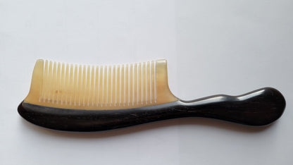 natural comb with African ebony wood handle and beige ram horn teeth.  Anti Static Natural Comb | Arakicrafts