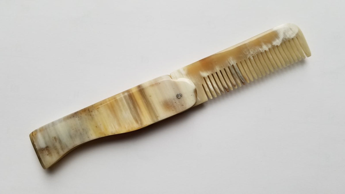 Folding Yak Horn Comb open view — striped natural horn handle, fine teeth, vintage pocket comb
