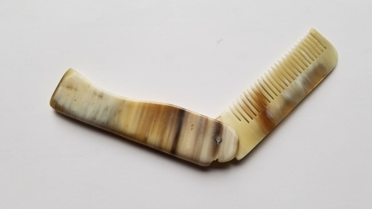 Folding Yak Horn Comb folded — pocket size, fine teeth protected, travel-ready grooming comb