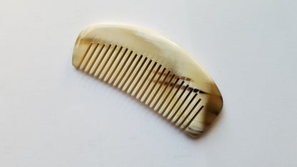 Pocket yak horn comb for travel and on-the-go grooming, pale cream natural horn, fine teeth distribute hair oils for healthy shine