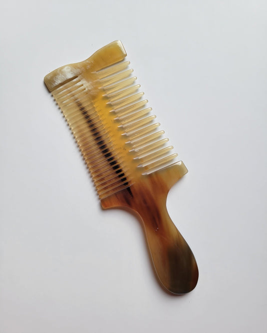 Natural Yak Horn double-sided comb showing its unique color and grain variation