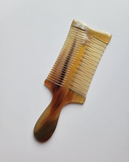 Handcrafted Yak Horn comb with a smooth, warm surface and refined natural pattern