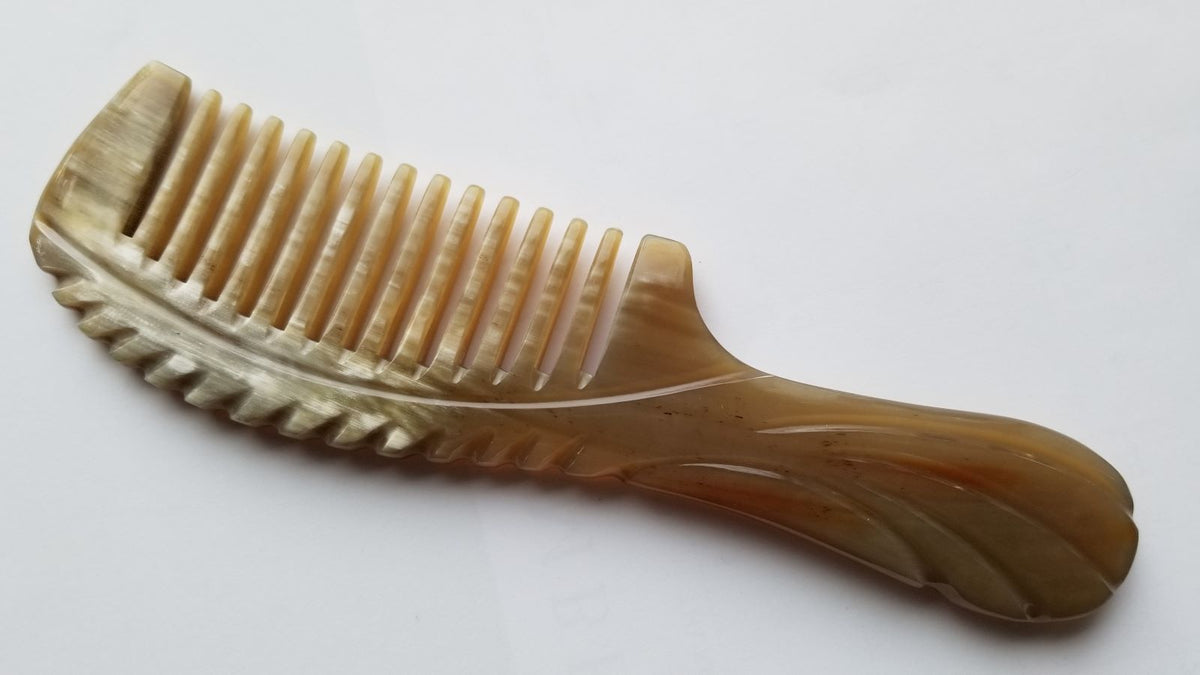 Wide round teeth on natural yak horn comb, flat lay close-up showing 0.3 cm tooth spacing — Arakicrafts