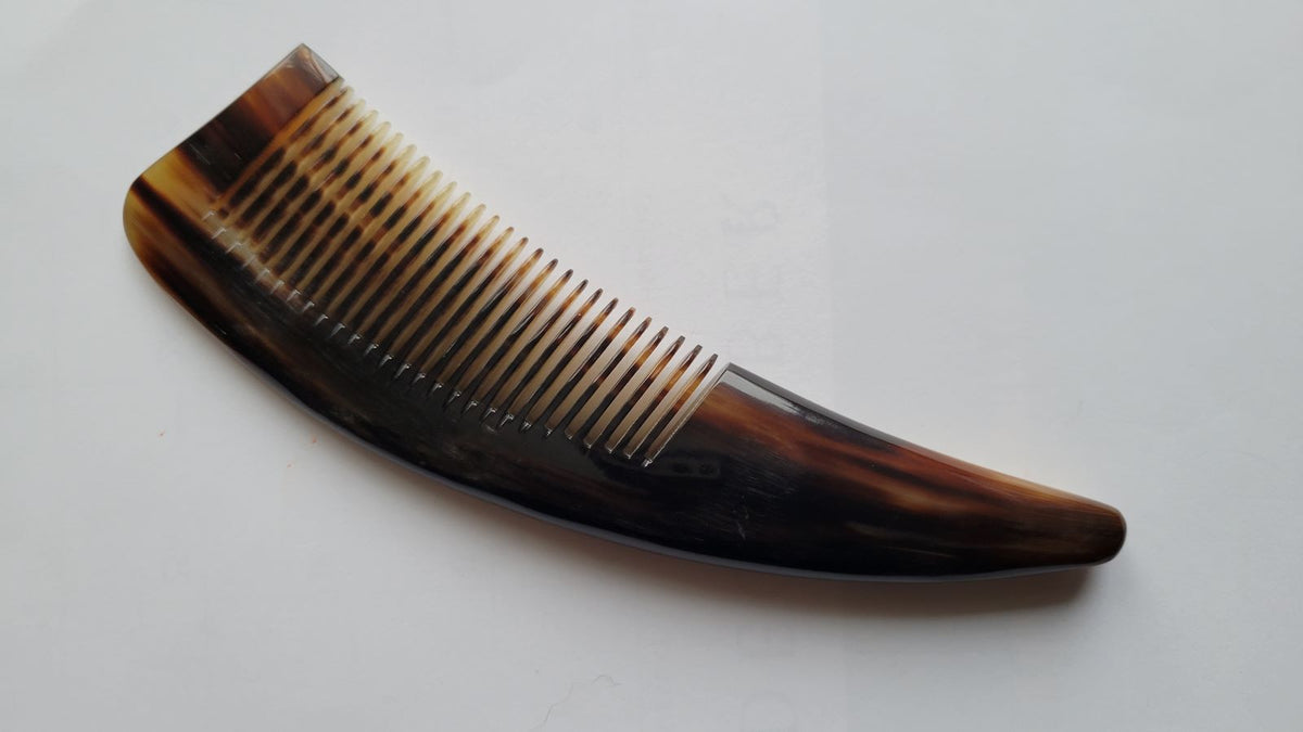 Yak horn comb with naturally curved handle, deep chocolate-brown and amber grain, fine tooth hair and beard comb, single-piece natural horn