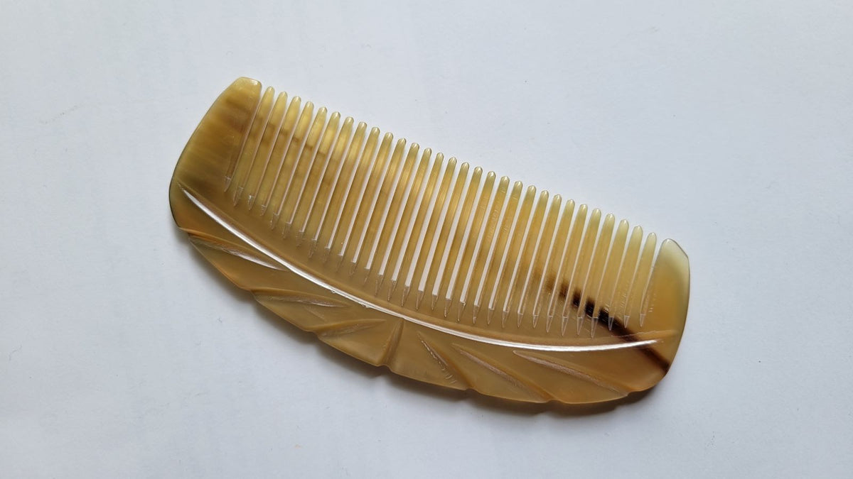 Fine tooth yak horn comb with 0.15 cm tooth spacing, Art Deco-influenced engraved spine, snag-free detangling for fine and all hair types | Arakicrafts