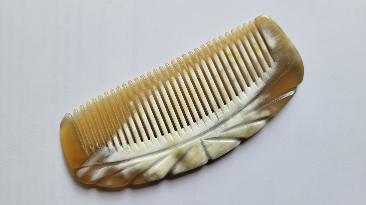 Yak horn fine tooth comb with Art Deco-influenced engraved radiating line pattern, warm amber translucent horn, natural grooming comb | Arakicrafts