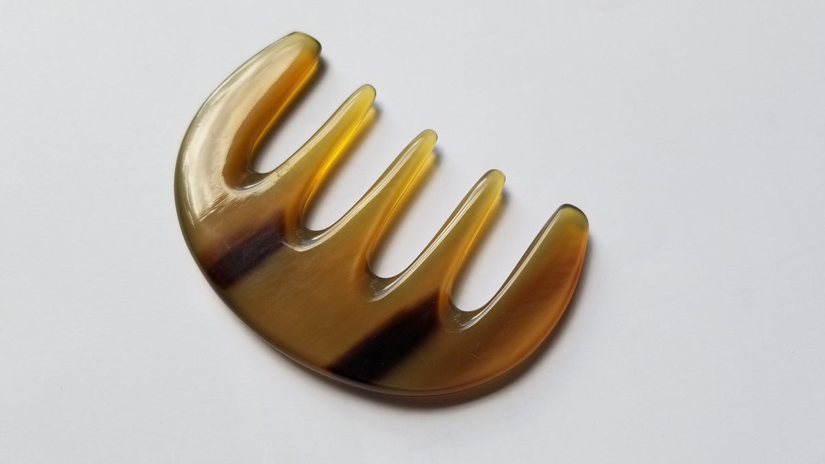 Travel-sized yak horn comb for women — five wide teeth, amber and brown natural horn, pocket size — Arakicrafts